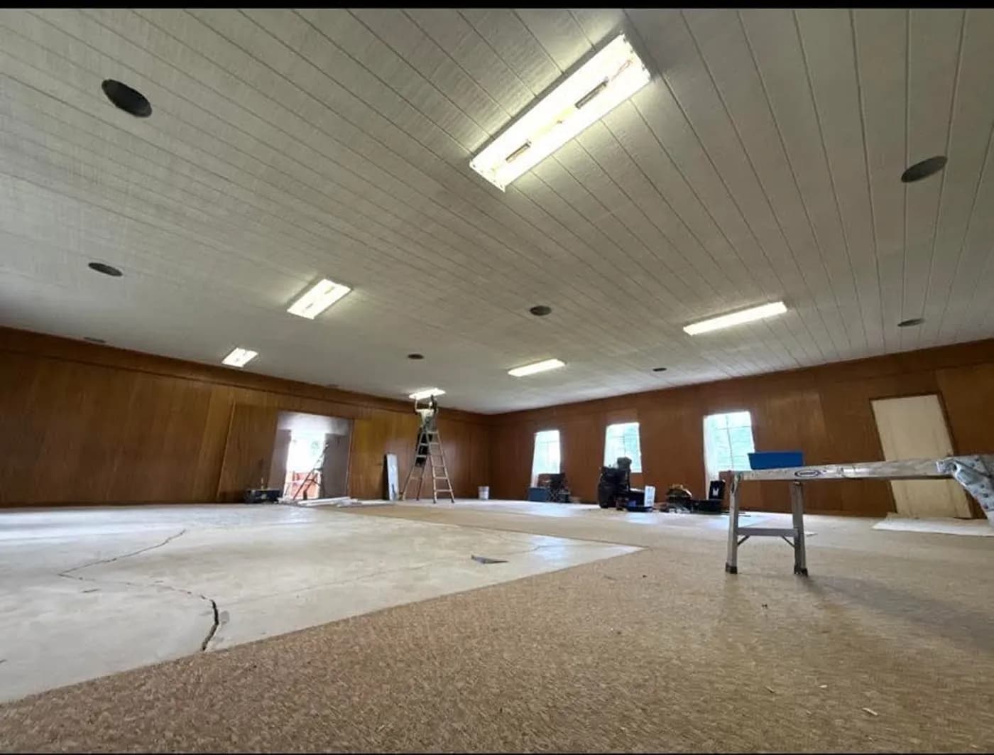 Large hall mid-remodel with prepped floors